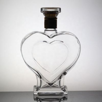 Op maat gemaakte hartvormige glazen fles met kroonkap en deksel uniek ontwerp